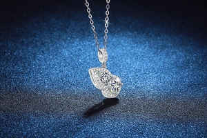 Macro view of S925 sterling silver gourd pendant with pear-cut moissanite stones