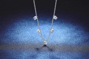 Detailed view of S925 sterling silver ball chain with five 1-carat moissanite pendants