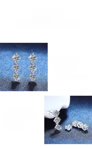 Macro shot of 3-carat moissanite silver stud earrings with vertical triple stone setting