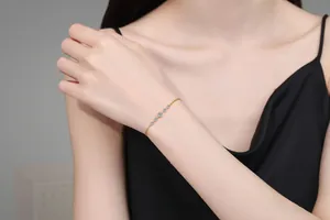 Detail of adjustable S925 silver gold bracelet with five sparkling moissanite stones