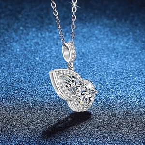 Elegant S925 sterling silver necklace with teardrop moissanite pendant on blue background