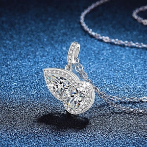 Elegant S925 silver necklace with pear-cut moissanite gourd pendant on blue fabric