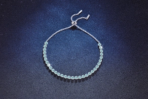 Macro shot of S925 silver adjustable bracelet with gradient light blue gemstones