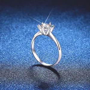 Classic six-prong S925 sterling silver ring with 1-carat moissanite on blue background