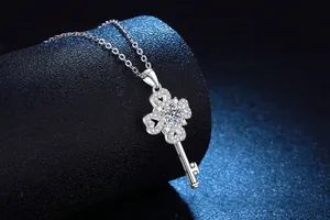 Macro shot of S925 silver clover key pendant with brilliant cubic zirconia stones