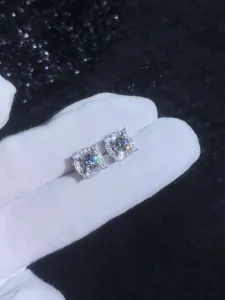 Macro shot of S925 sterling silver moissanite stud earrings in a crown four-claw setting
