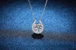 Close-up of horseshoe pendant with 2ct round moissanite in polished s925 silver