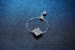 Detail showing an S925 silver chain ring with a four-claw set sparkling moissanite stone