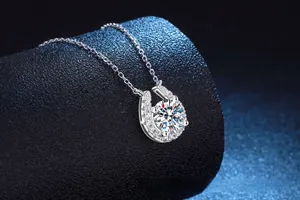 Macro detail of S925 sterling silver horseshoe pendant with 2ct moissanite gemstone