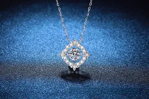 Macro view of 1ct moissanite dancing stone pendant on polished 925 silver chain