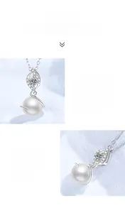 Macro d'un pendentif en argent 925 avec une moissanite goutte et une perle d'eau douce