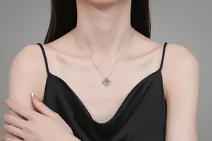 Detail of S925 sterling silver necklace featuring a dancing moissanite square pendant