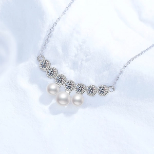 Elegant S925 silver necklace featuring curved diamond accents and three white pearls