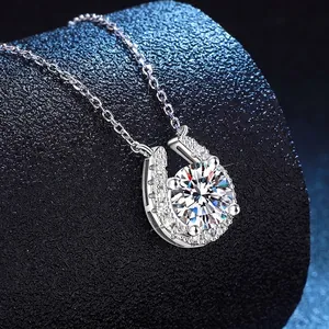 S925 sterling silver horseshoe necklace with 2ct moissanite center stone on dark blue background