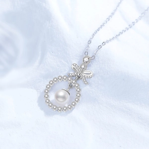 Elegant S925 silver bow necklace with round freshwater pearl and moissanite pendant