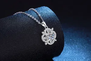 Macro shot of silver four-leaf clover pendant with sparkling 1ct moissanite stones