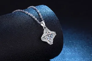 Macro shot of S925 sterling silver four-point star necklace with 1ct moissanite center