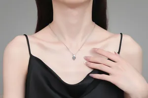 Detail of S925 sterling silver heart pendant necklace with 1 carat sparkling moissanite stone