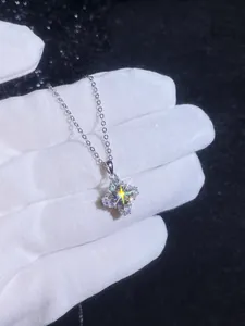 Detailed close-up of S925 sterling silver four-pointed star necklace with moissanite stones