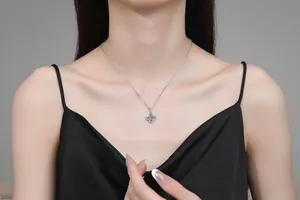 Close-up of S925 sterling silver four-pointed star pendant with 1ct moissanite stones