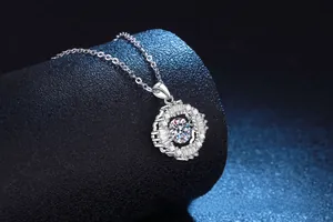 Macro shot of 925 silver moissanite pendant featuring brilliant round and baguette cut stones
