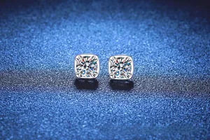 Close-up of S925 sterling silver square stud earrings with moissanite four-prong setting