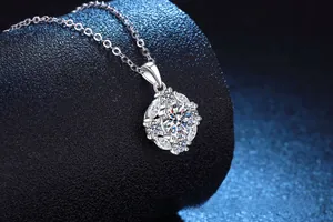 Macro shot of 925 silver moissanite rose pendant necklace on black display stand
