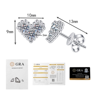Macro detail of S925 silver heart earrings with size markers and GRA certification card