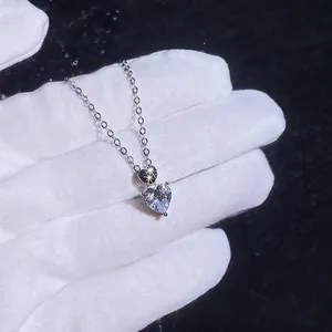 925 sterling silver heart necklace with 1 carat moissanite pendant shown on a hand