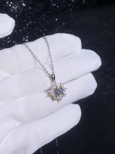 Detail of 925 sterling silver dreamcatcher necklace with a sparkling 1 carat moissanite