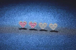Detailed view of S925 sterling silver heart earrings with pink and white zircon stones