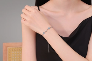 Detail of S925 sterling silver heart bracelet with 1ct moissanite stones on wrist