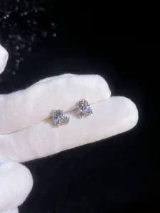 Close-up of D-color moissanite stud earrings in cluster setting with S925 silver