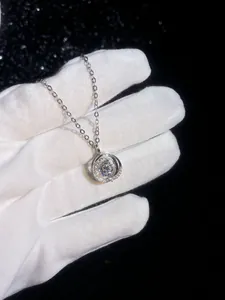 Macro shot of 925 silver swan heart necklace with 1 carat sparkling moissanite pendant