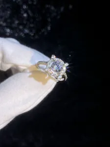Macro shot of 1 carat moissanite ring in S925 sterling silver with halo setting