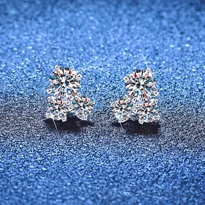 Three-stone cluster S925 sterling silver moissanite stud earrings on starry blue background