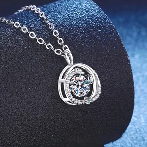 Elegant 925 silver moissanite necklace with a rotating heart pendant on dark stand
