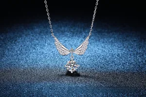 Detailed view of S925 sterling silver angel wing necklace with 1 carat moissanite pendant