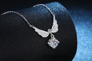 Detailed view of S925 sterling silver angel wing necklace with round moissanite stones