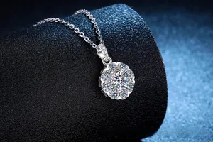 Macro shot of S925 sterling silver moissanite sunflower pendant on black leather