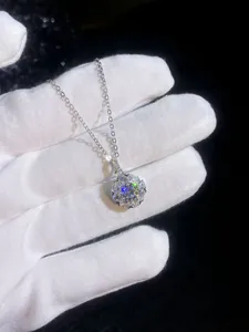 Macro shot of S925 sterling silver sunflower pendant with brilliant moissanite stones