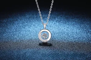 Macro shot of S925 sterling silver donut pendant with dancing moissanite center stone