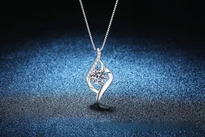 Macro detail of S925 silver necklace with 1 carat moissanite in Cupid heart pendant