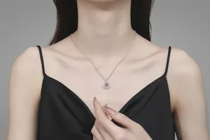 Close-up of S925 sterling silver moissanite donut dancing heart pendant on a woman