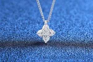 Macro detail of S925 sterling silver four-pointed star pendant with marquise moissanite