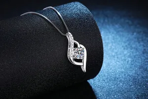 Macro detail of 1 carat moissanite heart pendant with brilliant cut round stone