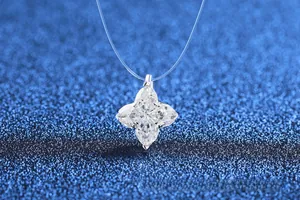 Macro shot of silver four-pointed star pendant with teardrop moissanite stones