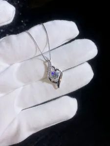 Macro shot of S925 sterling silver waterdrop pendant with 1 carat moissanite and micro stones
