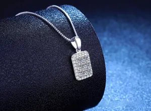 Macro shot of S925 sterling silver square moissanite pendant on a sleek box chain