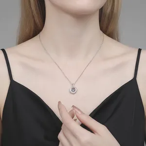 Elegant S925 sterling silver dancing moissanite necklace on female model neck